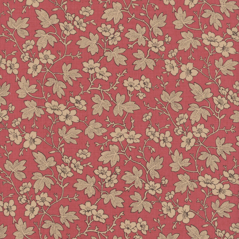 Pink fabric featuring cream leaves and flowers