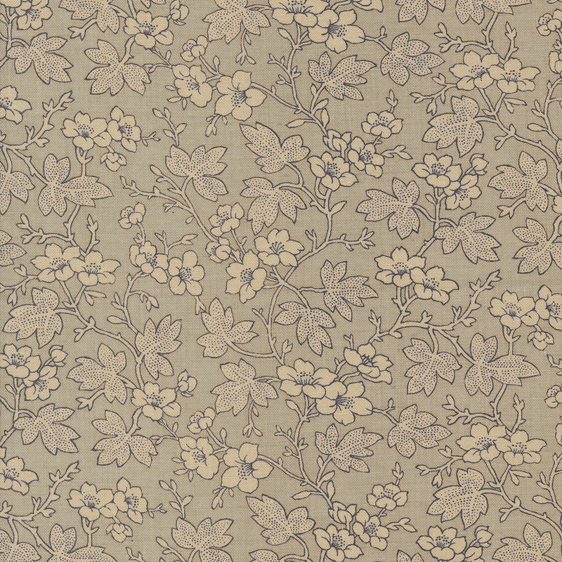Gray fabric featuring cream leaves and flowers outlined in dark blue