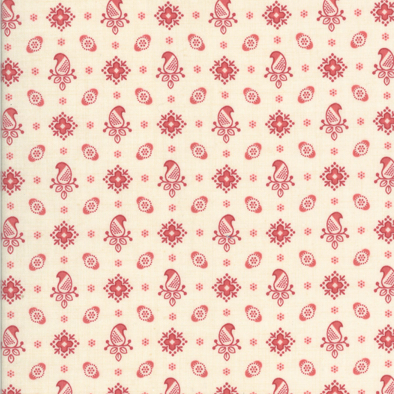Cream fabric featuring a pattern of paisleys and florals