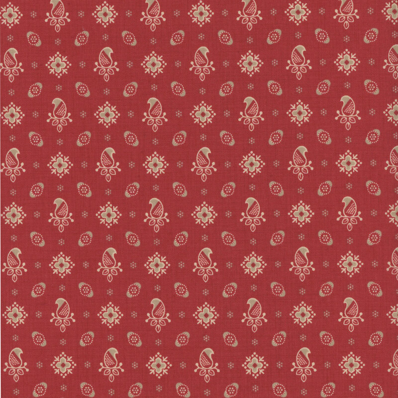 Red fabric featuring a pattern of paisleys and florals