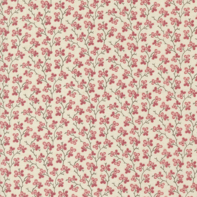 cream fabric featuring a pink floral design