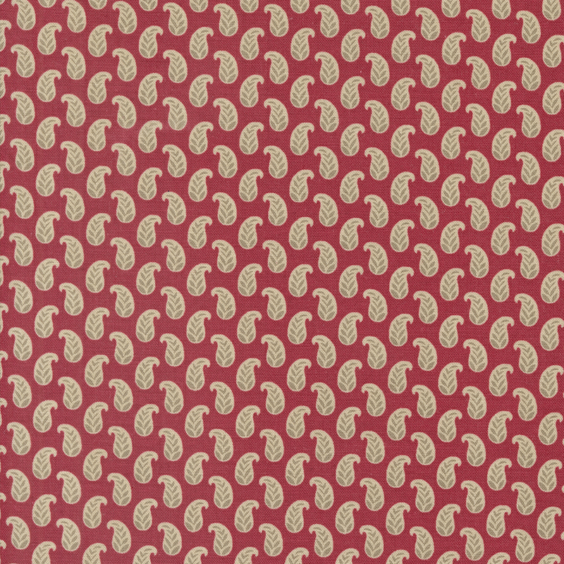 red fabric featuring cream paisleys