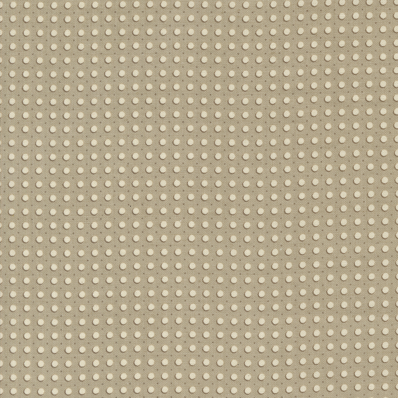 gray fabric featuring cream dots