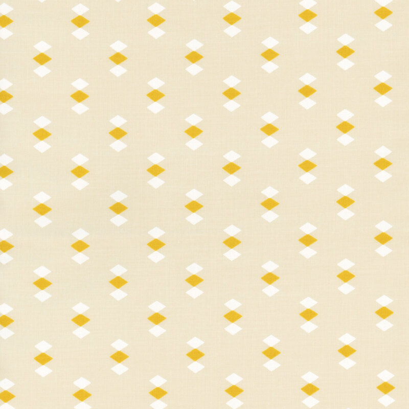 Eggshell-colored fabric featuring evenly spaced clusters of yellow and white diamonds throughout