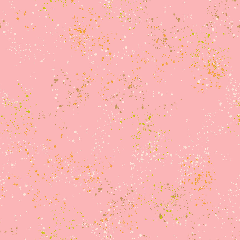 Light pink fabric featuring varying shades of brown, cream, and orange speckles throughout