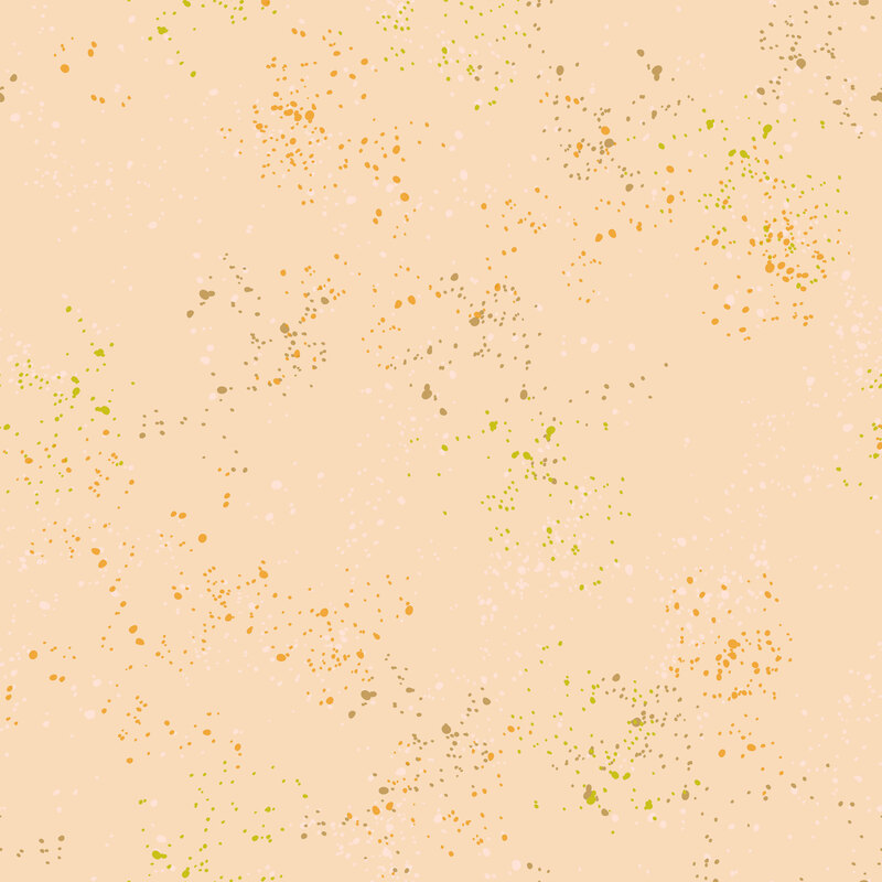 peach fabric featuring varying shades of brown, tan, and orange speckles throughout