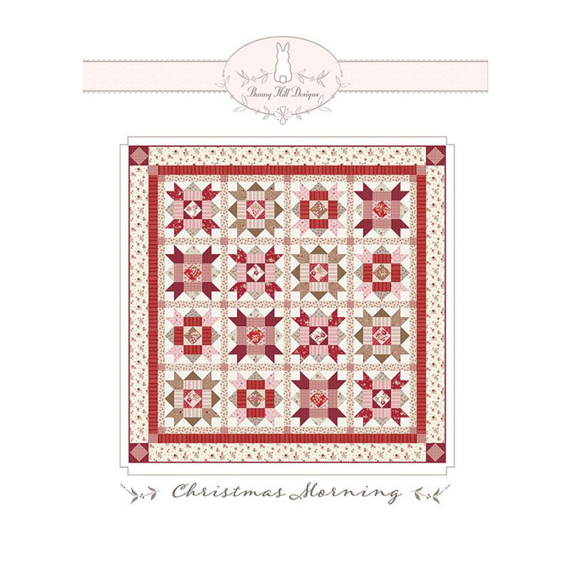 Front of the pattern, featuring an image of the finished quilt in red, pink, and cream