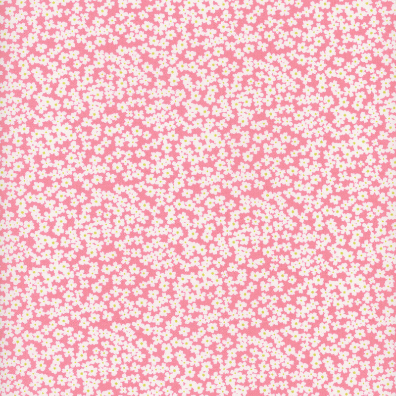 Bright pink fabric with small white flowers all over