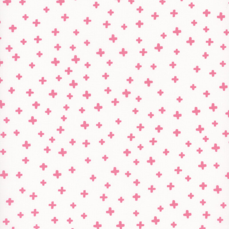 White fabric with bright pink geometric plus signs in varying sizes
