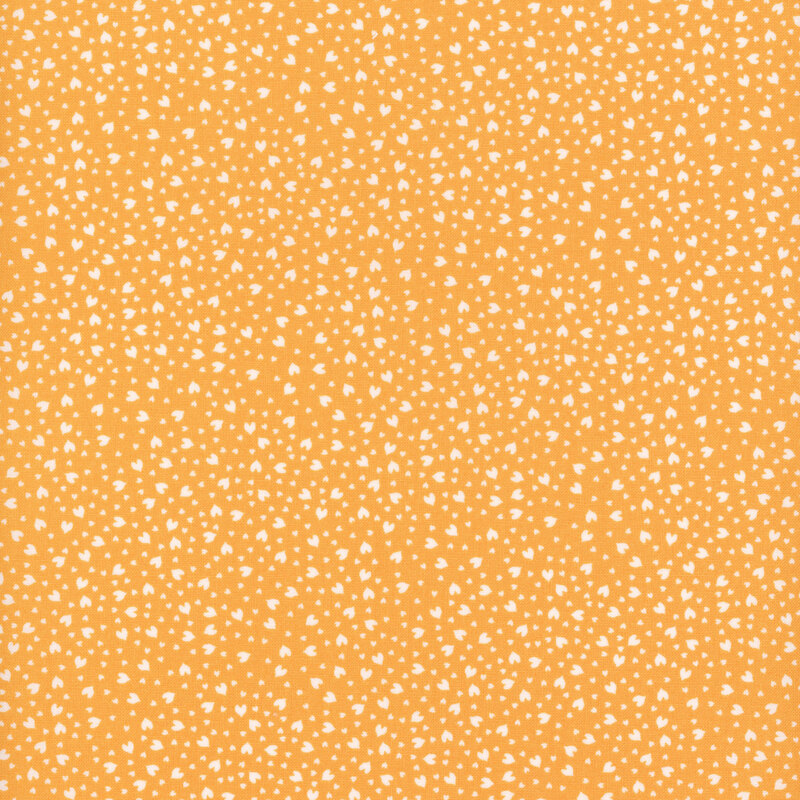 Bright orange fabric with small white hearts scattered throughout