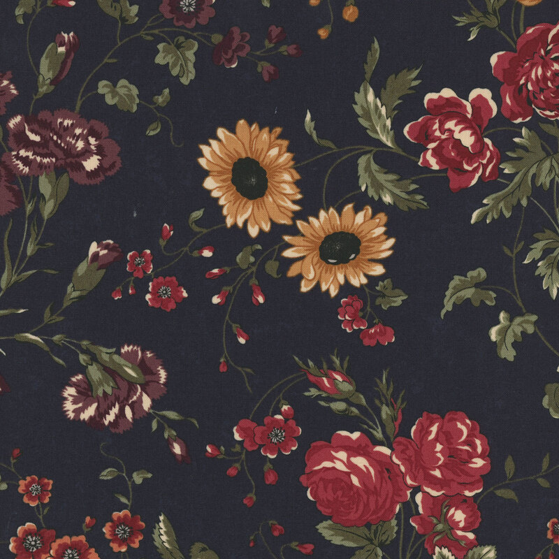 A saturated navy blue fabric with red, yellow, and orange florals and swirling green vines throughout
