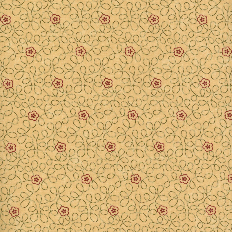 Tan fabric with swirling dotted vines and small red florals throughout