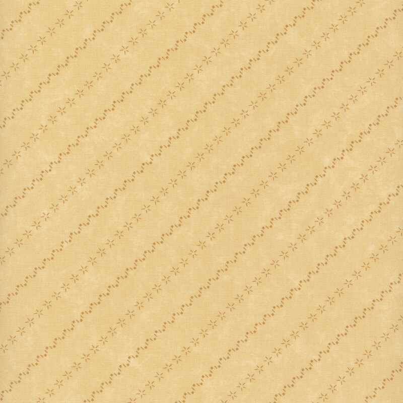 Tonal light tan fabric with mottling and alternating diagonal stripes made of stars and zig-zag patterns.