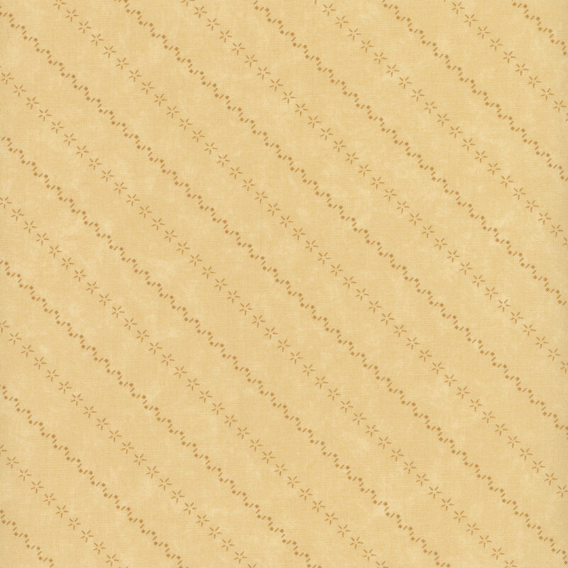 Tonal light tan fabric with mottling and alternating diagonal stripes made of stars and zig-zag patterns.