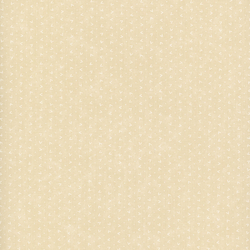 Cream-colored fabric with a pattern of white dots and v shapes.