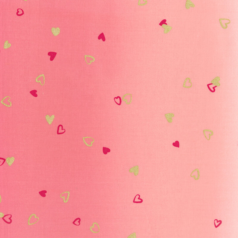 pink fabric featuring an ombre design with small metallic and hot pink hearts