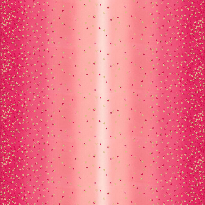 pink fabric featuring an ombre design with small metallic and hot pink hearts