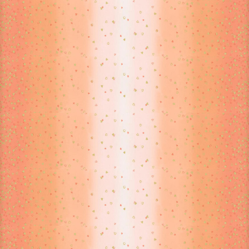 light peach fabric featuring an ombre design with small metallic and orange hearts