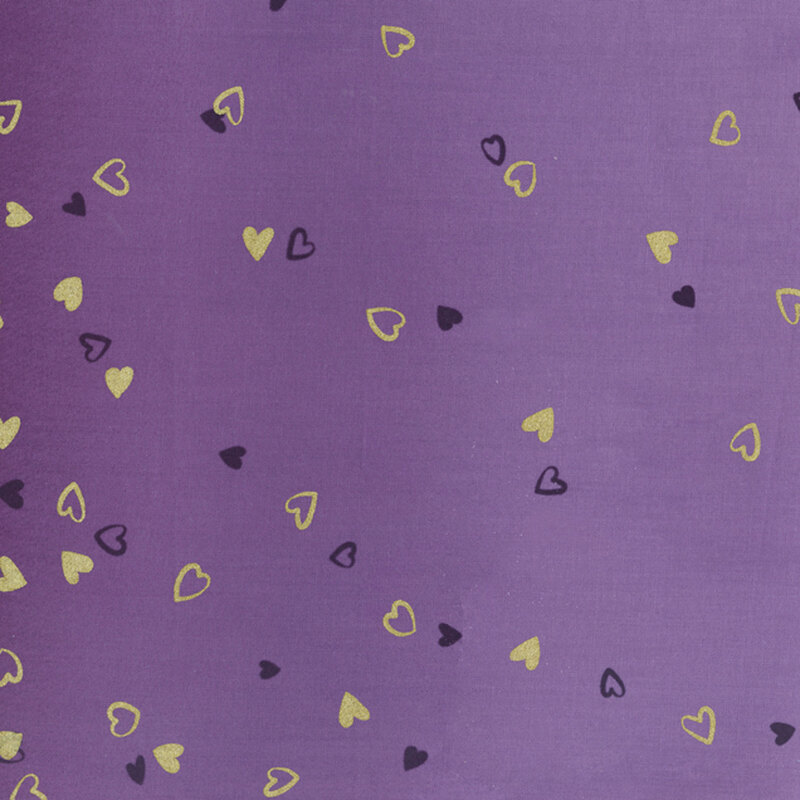 purple fabric featuring an ombre design with small metallic and dark purple hearts