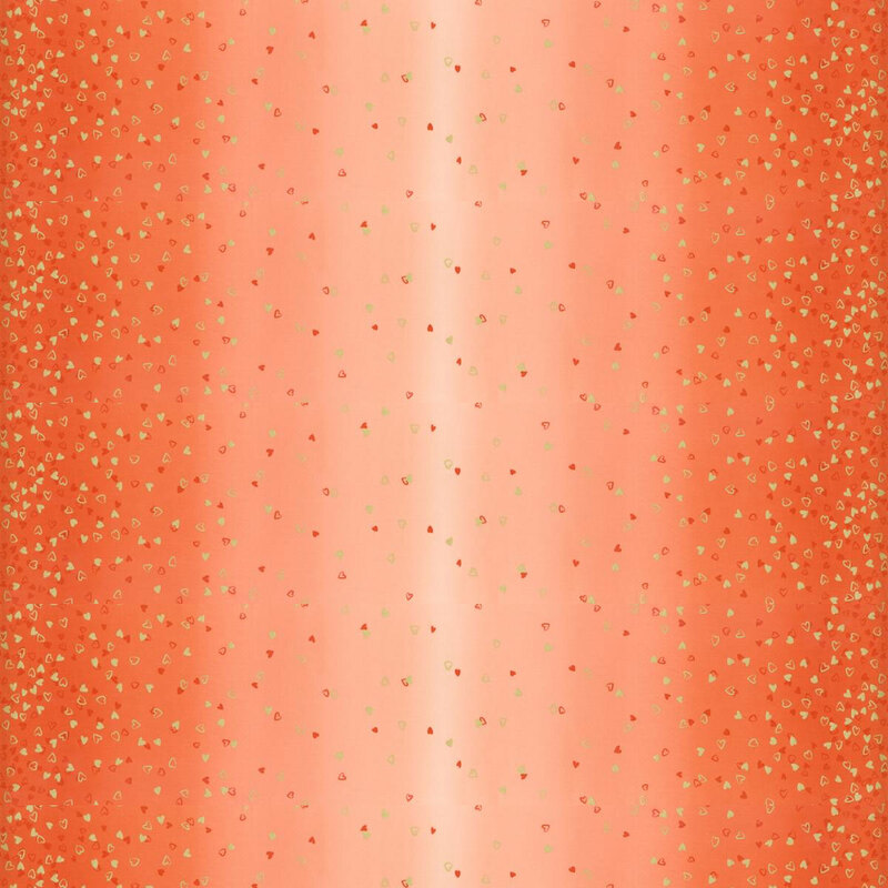 peach fabric featuring an ombre design with small metallic and orange hearts