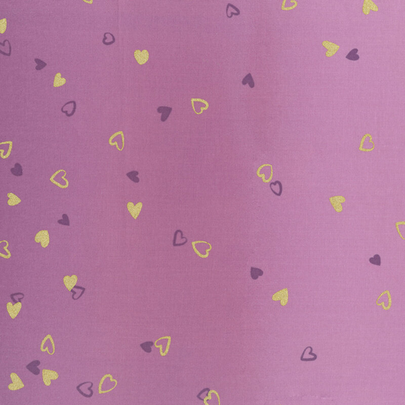 Purple fabric featuring an ombre design with small metallic and dark purple hearts