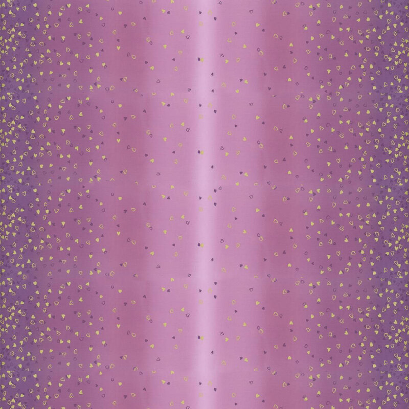 Purple fabric featuring an ombre design with small metallic and dark purple hearts