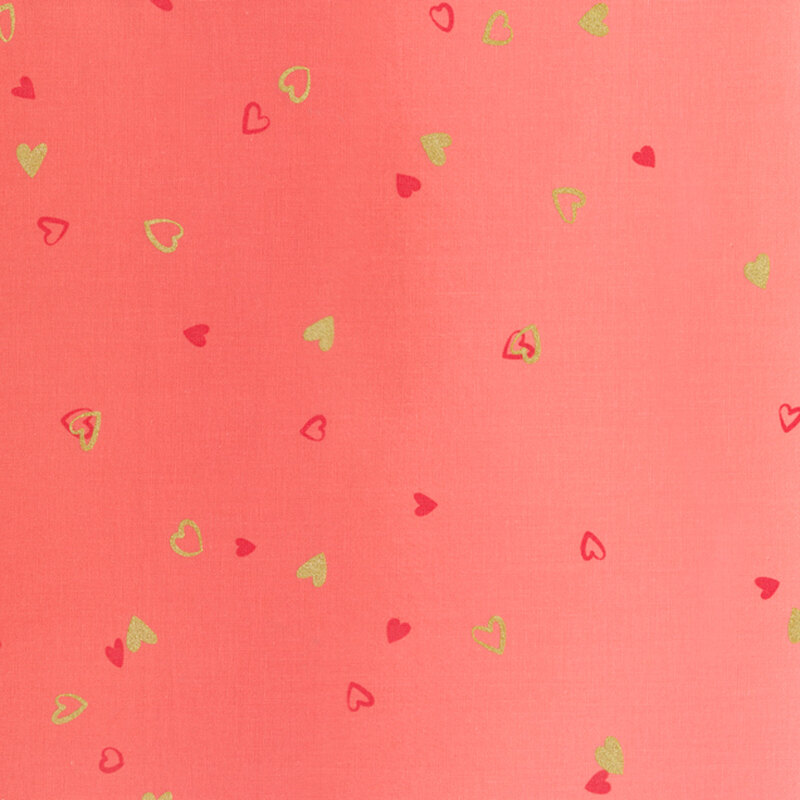 Coral pink fabric featuring an ombre design with small metallic and dark pink hearts