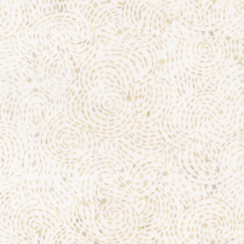 White fabric with cream and beige mottled dotted circles.
