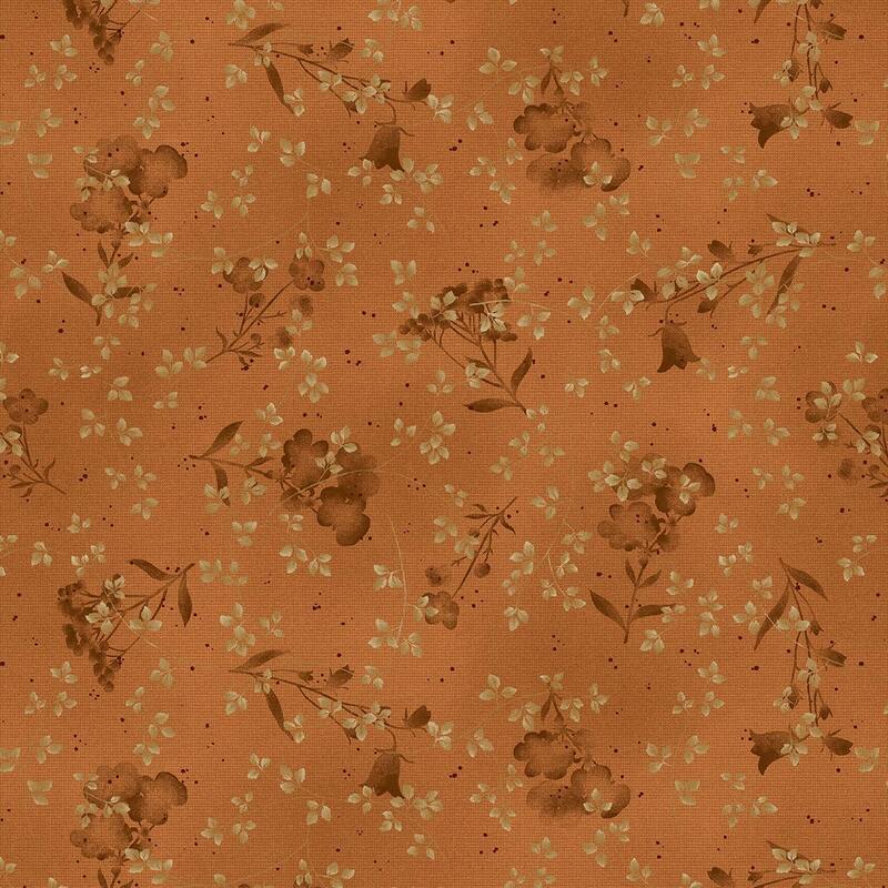 orange mottled fabric featuring pressed flowers and leaves