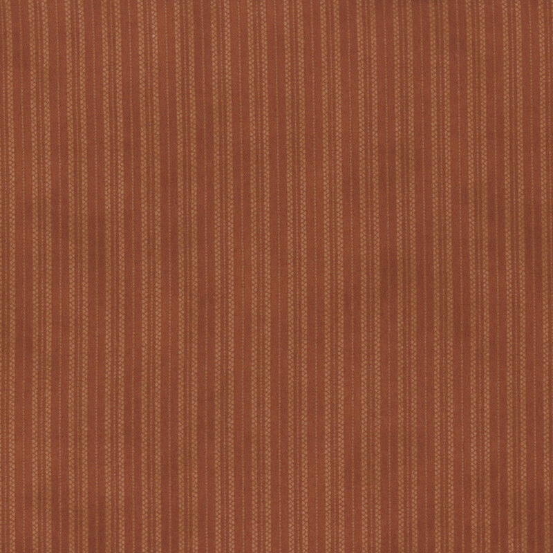 Burnt orange fabric featuring a dotted striped design