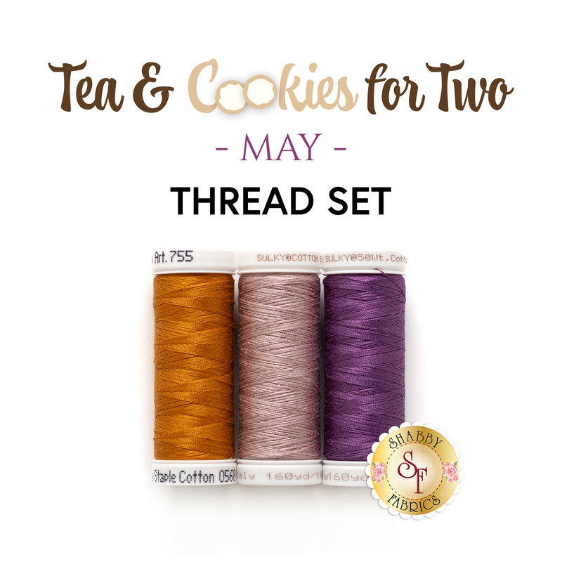 The coordinating thread set for the May placemats, three spools of thread arranged in rainbow order and isolated on a white background below the text graphic 