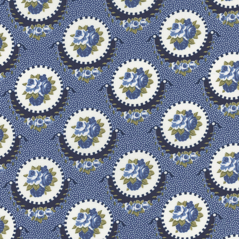 Section of a navy blue fabric with large navy and white medallions with clustered blue flowers inside.