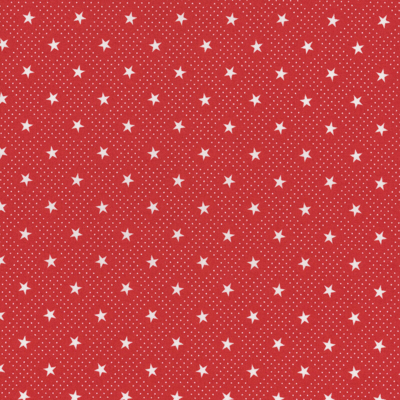 Section of a red fabric with patterned white stars.