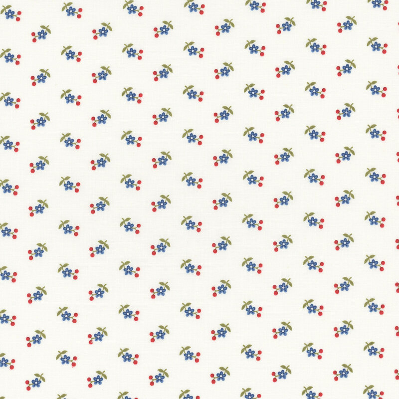 Section of a cream fabric with small blue flowers and red berries.