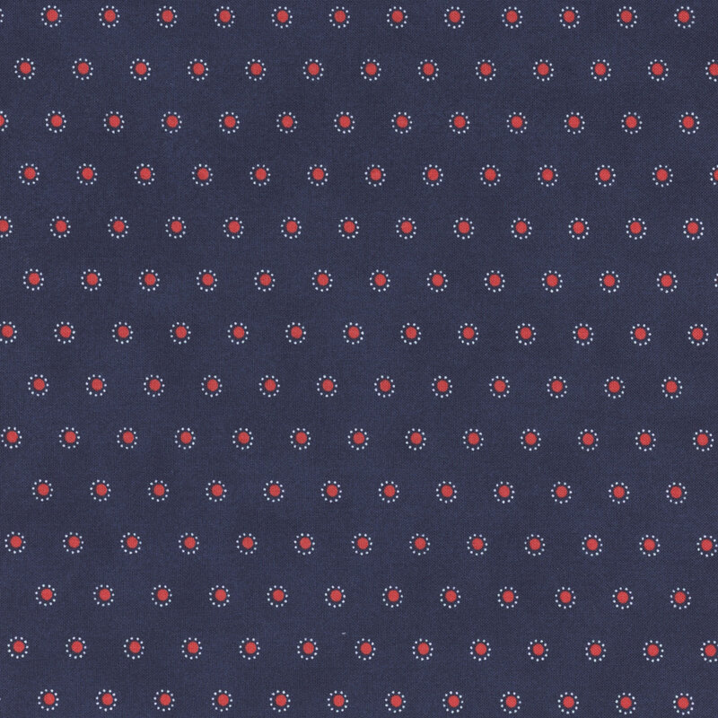Section of a blue fabric with small rows of red polka dots surrounded by smaller white dots.