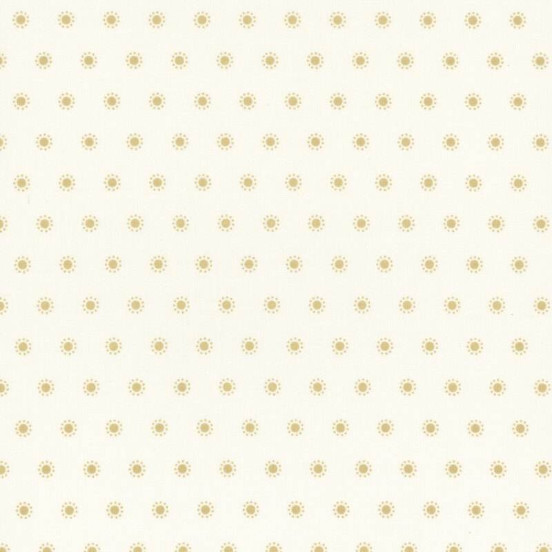 Section of a cream fabric with small rows of tan polka dots surrounded by smaller dots.