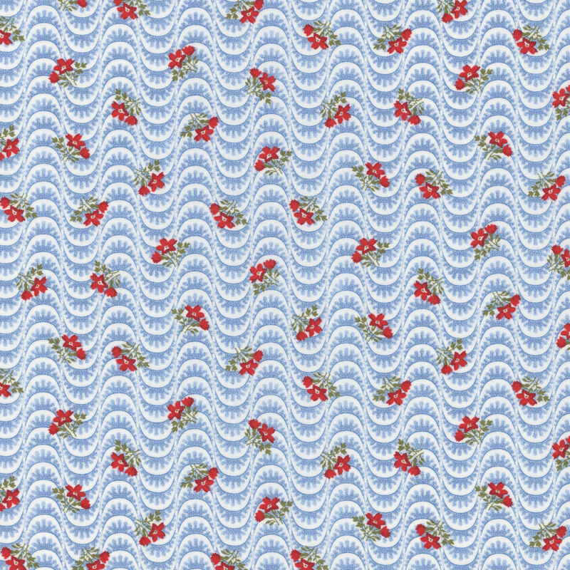 Section of a light blue fabric with blue wavy lines and ditsy red florals.