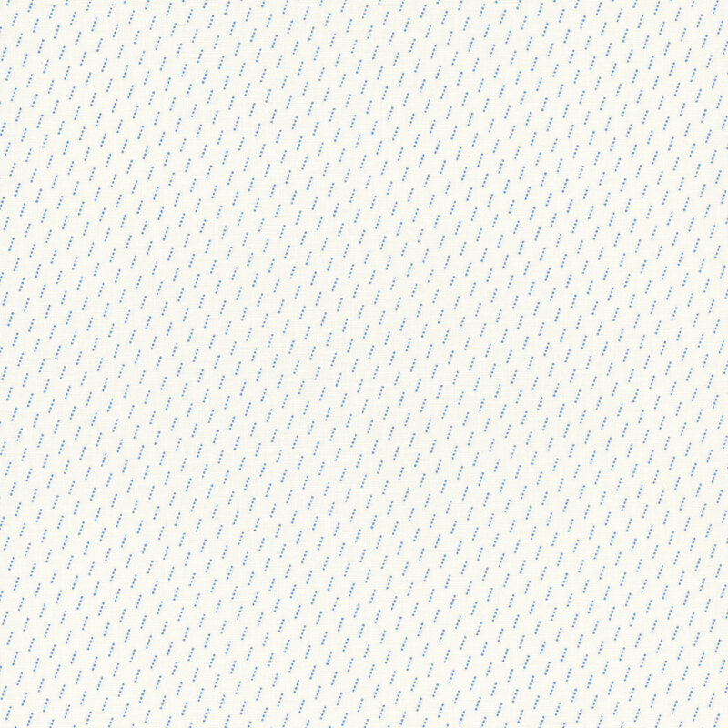 Section of a cream fabric with small blue diagonal lines.