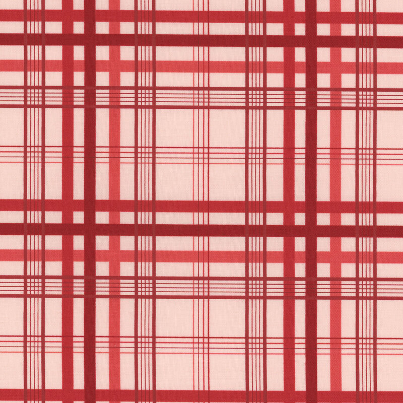 Section of a pink fabric with red plaid.