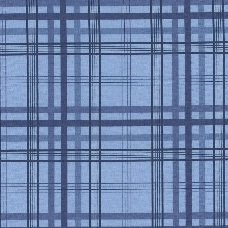 Section of a blue fabric with navy plaid.