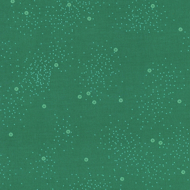 A jade green fabric with small white daisies and little white speckles throughout