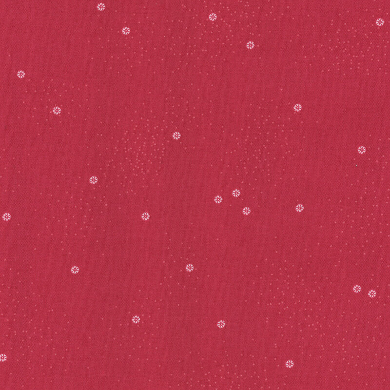 A berry-red fabric with small white daisies and little white speckles throughout