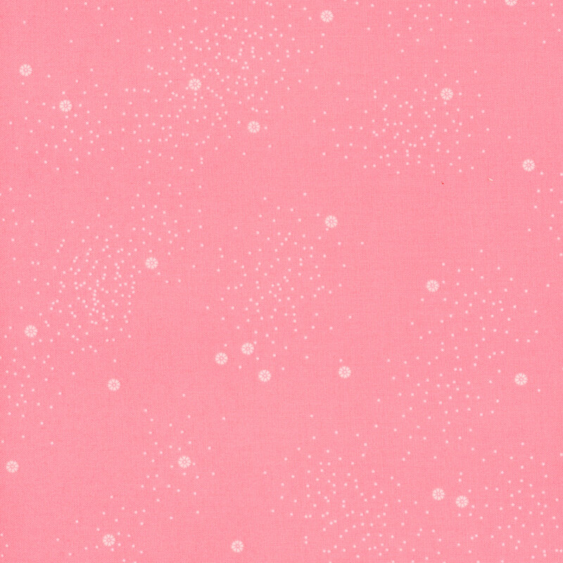 A light pink fabric with small white daisies and little white speckles throughout