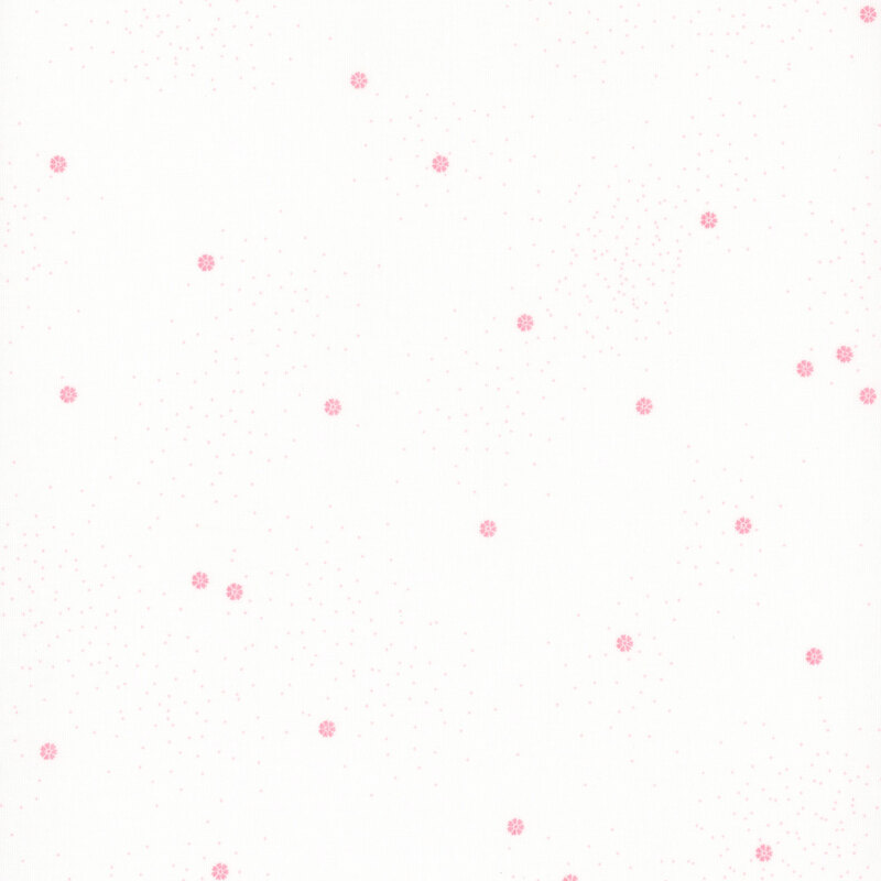 A white fabric with small pink daisies and speckles throughout