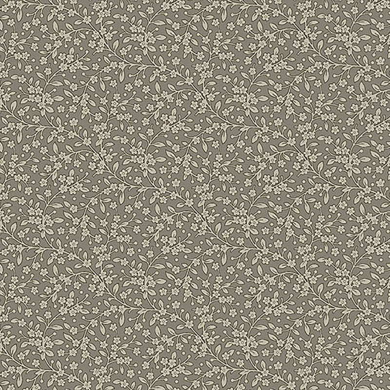 Tonal, greige fabric with light tan leaves and vines against a medium greige background
