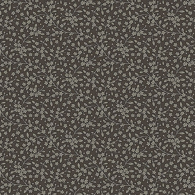 Section of fabric with gray leaves and vines all over a dark gray background