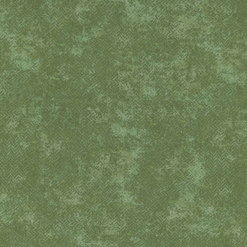 A mottled green fabric with a textured, zig zag look