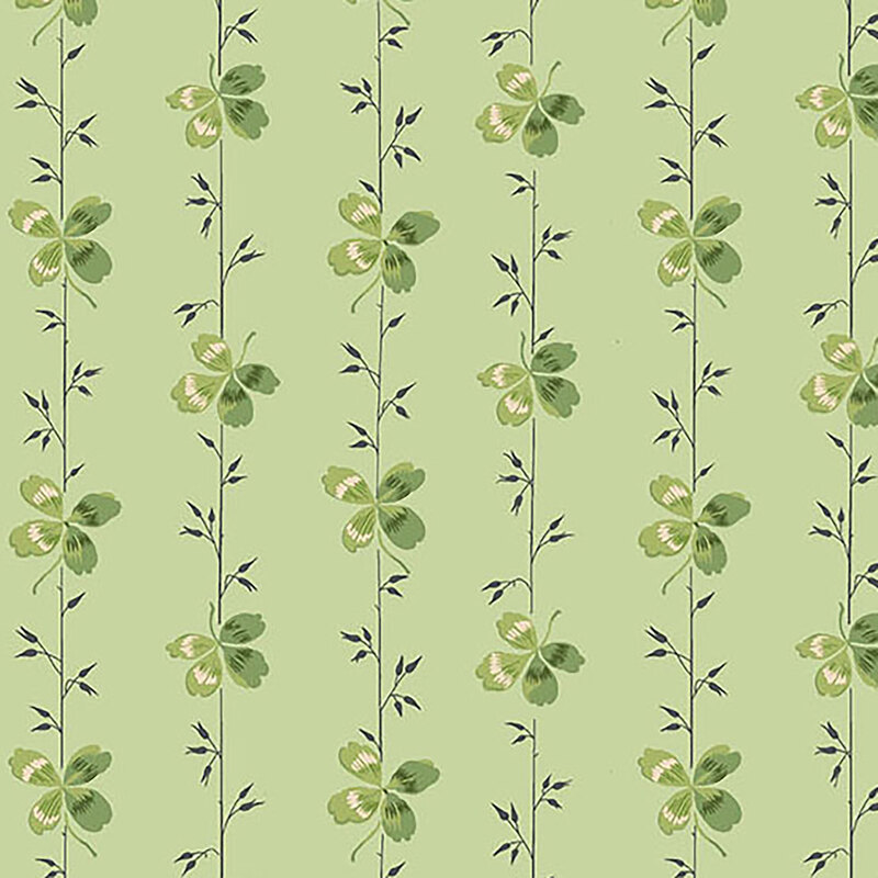 A light green fabric featuring stripes with small sprigs and clovers