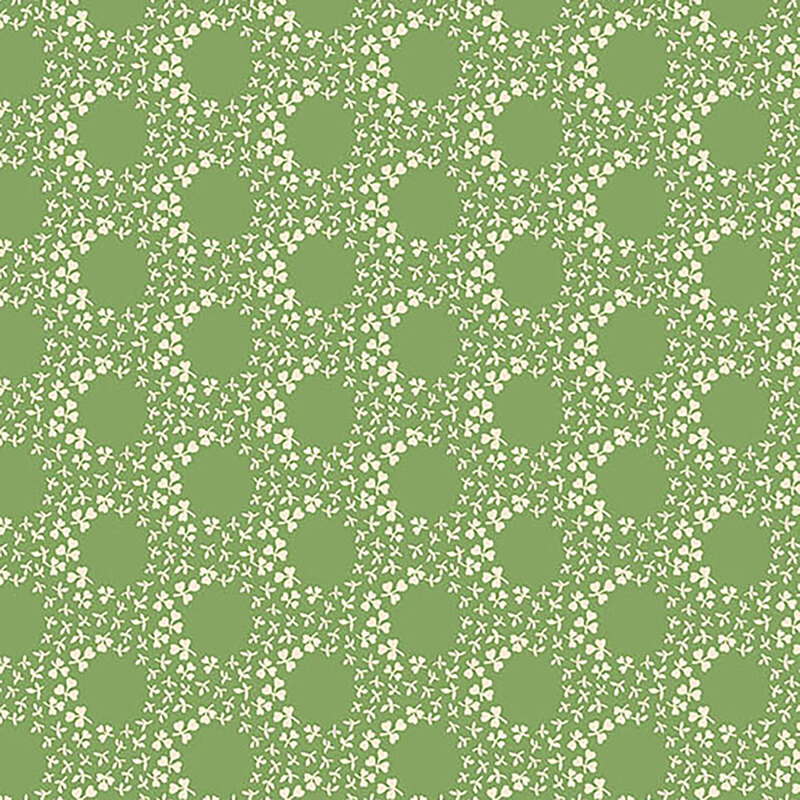 A grass-green fabric with rings of white clovers