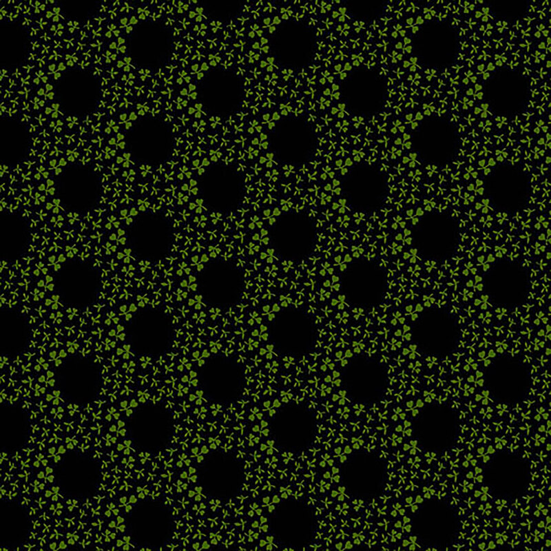 Black fabric with green clovers forming rings throughout